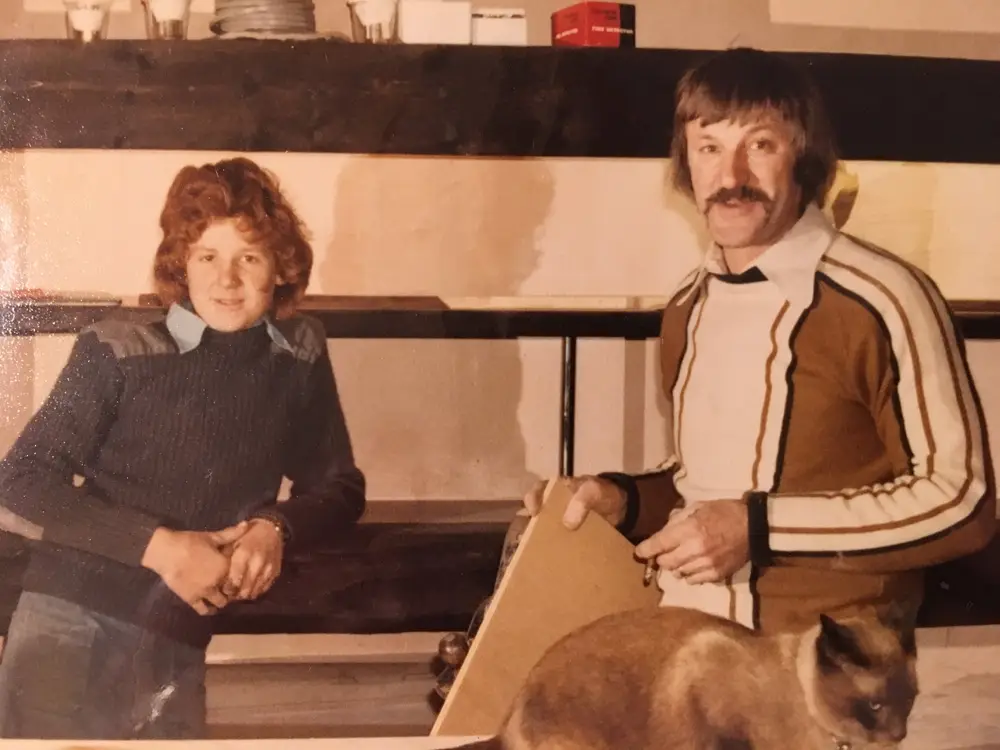 Behind the bar in the early days with the pub cat