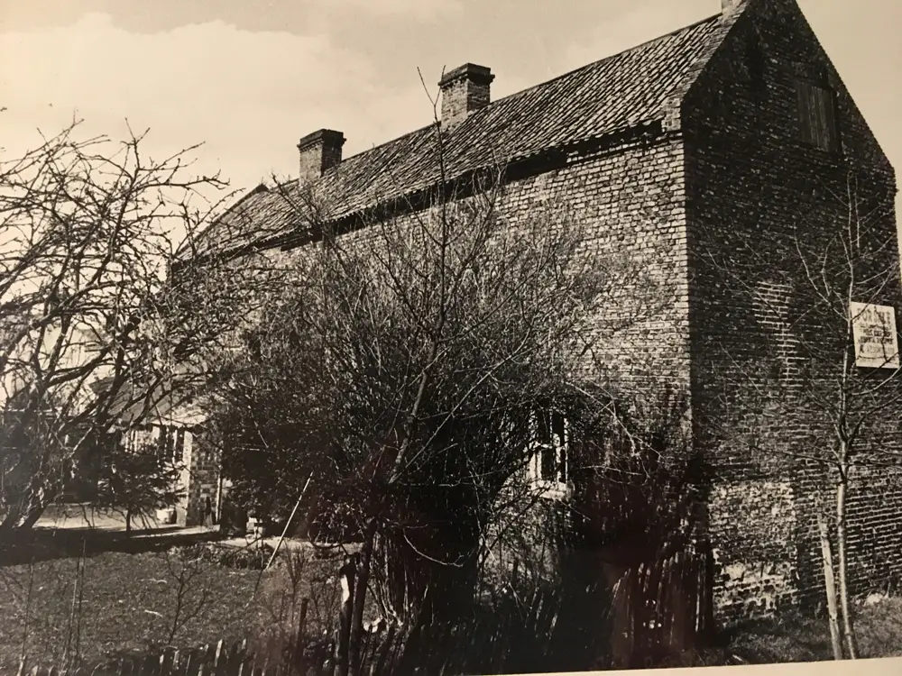 The original buildings on the High Street before restoration