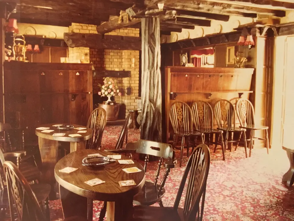 The lounge with barrel tables and wheelback chairs