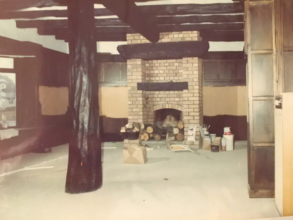 The brick fireplace and beams before the pub opened