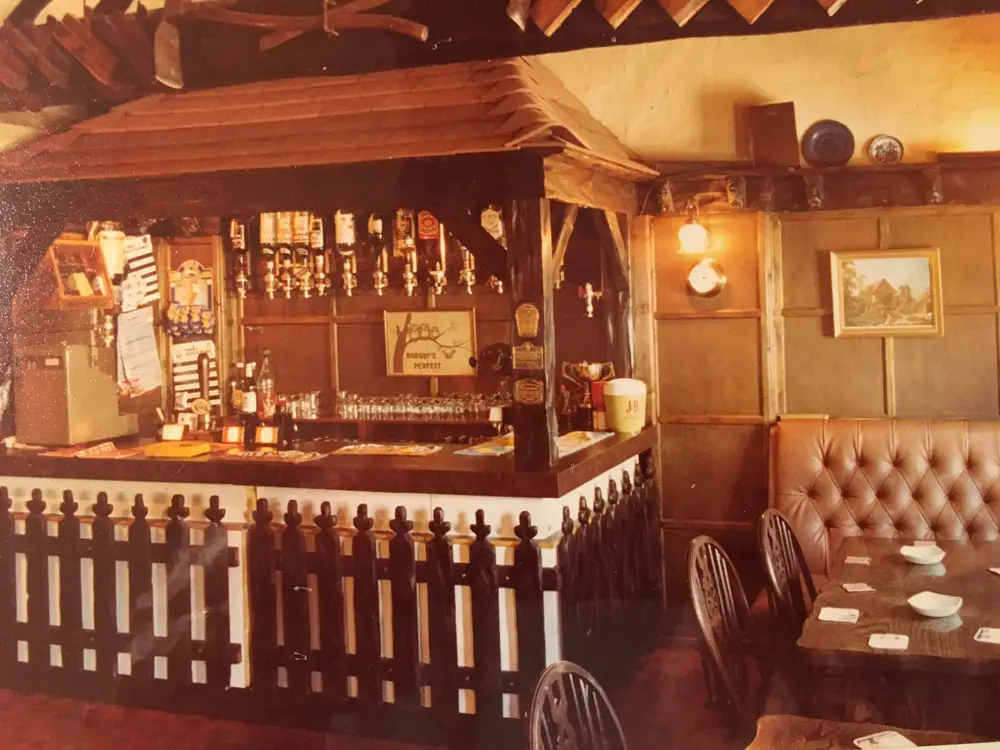 The original bar with hand pulls and thatched canopy